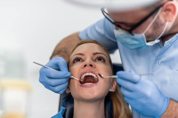 Woman at dentist office stock photo