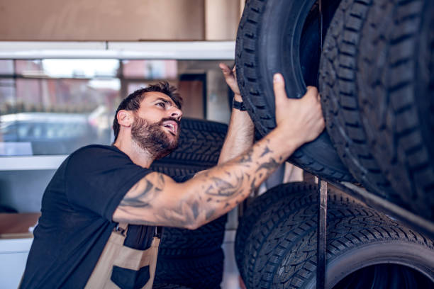 istock Car mechanics working in auto repair service station. 1455336677