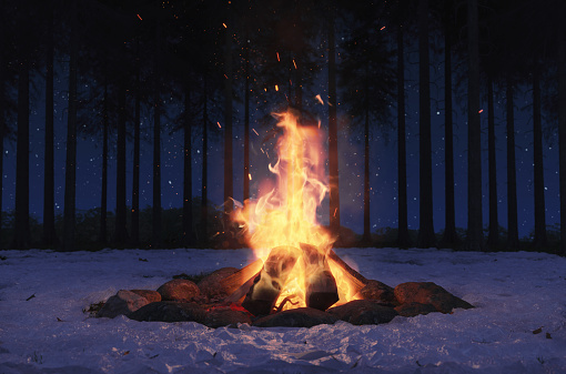 3d rendering of big bonfire with sparks and particles around snowy field and pine trees