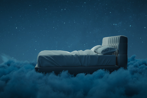 3d rendering of cozy bed over fluffy clouds at night