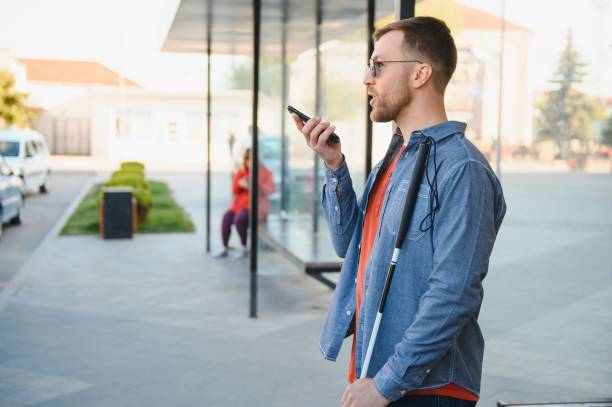istock Blinded man waiting for bus at a bus station 1455340499