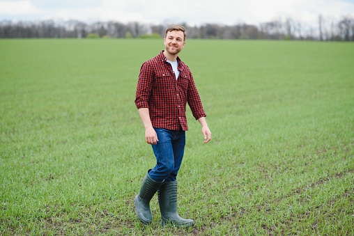 Portrait of farmer standing in wheat field
