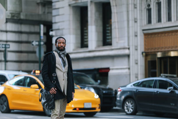 istock businessman walking in NYC financial district 1455342023