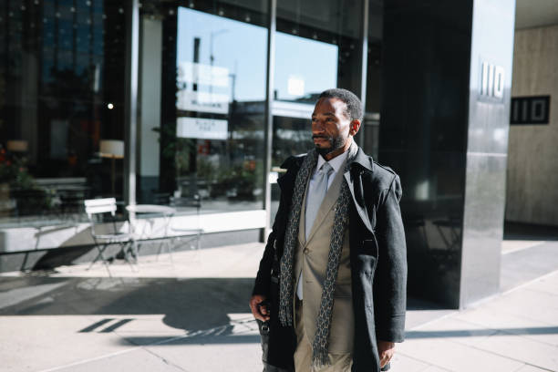 istock businessman walking to the NY office 1455342072