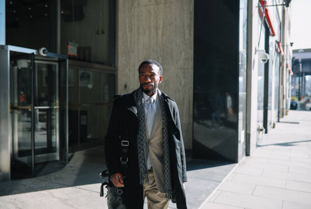istock businessman walking to the NY office 1455342335