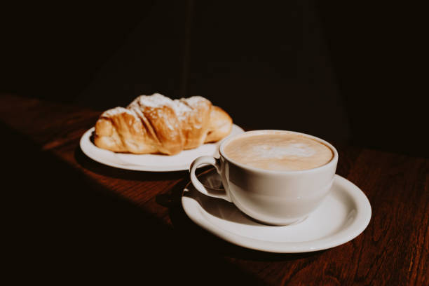 istock Cappuccino with latte art and croissant 1455342399