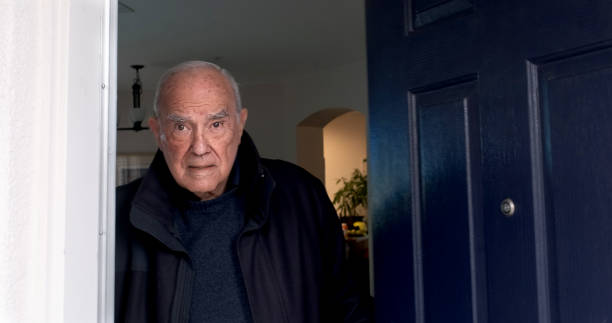 istock Serious Old hispanic man his home front door looking at the camera 1455342968