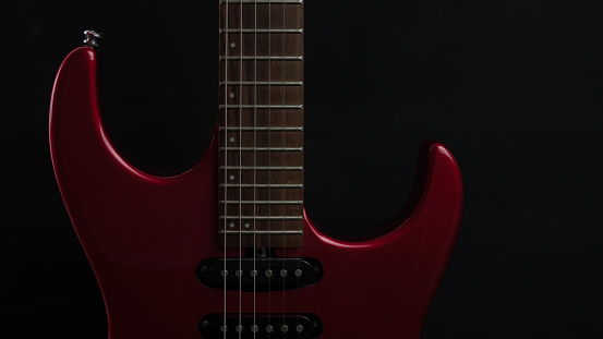 Rock guitarist playing guitar in a live show, lights and smoke