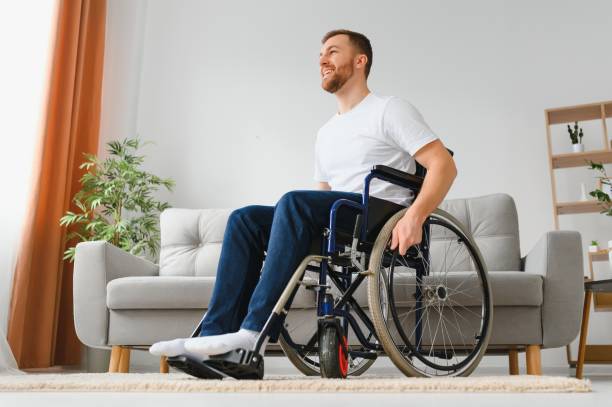 istock Young handsome man in wheelchair. 1455343716