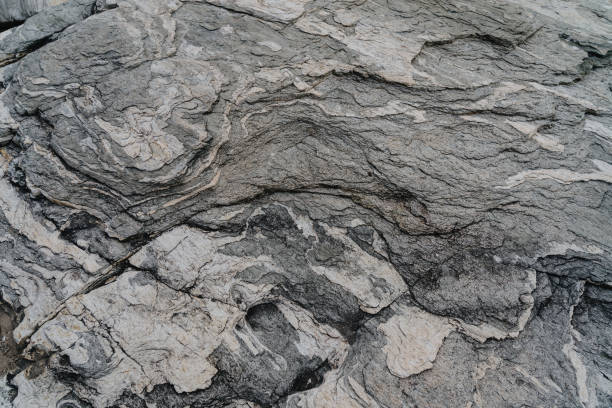 istock Gray rock natural surface used as background texture and wallpaper. 1455344852