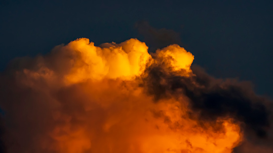 Abstract colorful orange sunset with cloudy sky and dramatic light