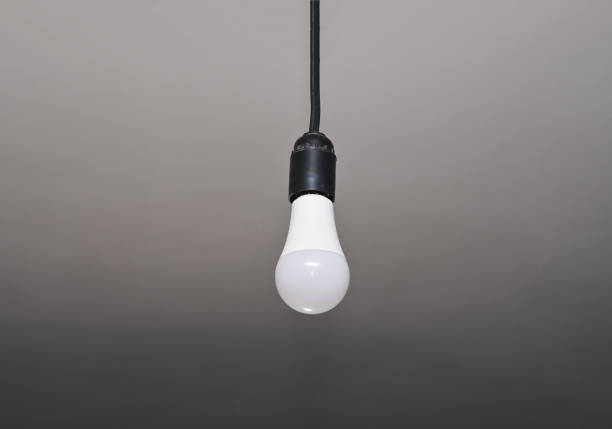 istock led bulb. an electric lamp is hanging on a wire. 1455346798