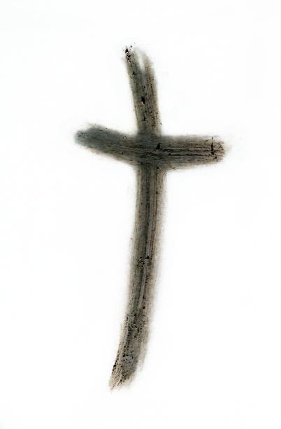 istock Ashen cross drawn on white with finger 1455353137