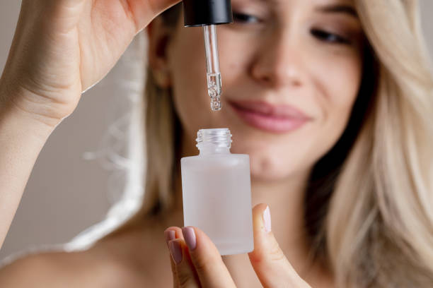 istock Woman Holding Face Serum 1455355536
