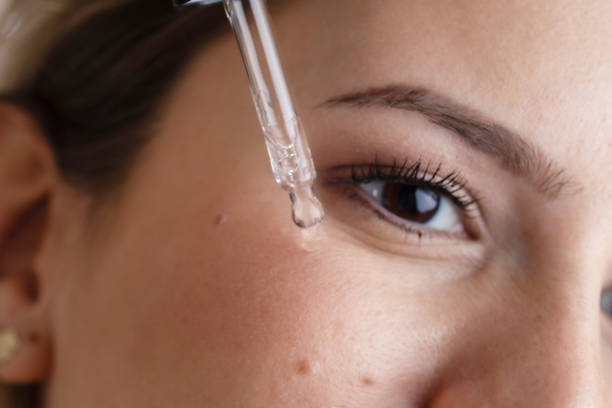 istock Woman Applying Serum 1455355539