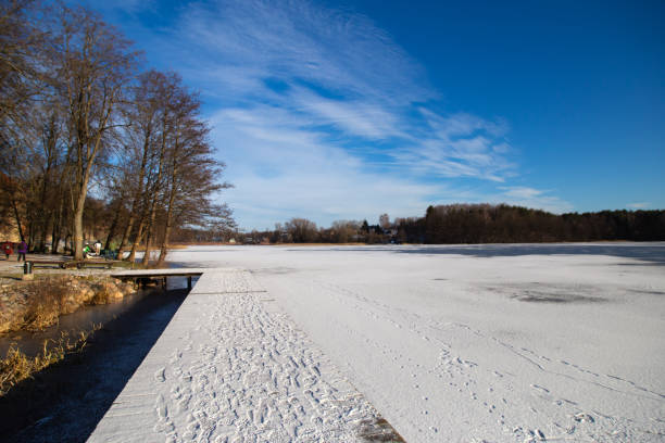 istock Trakai lake covered with ice in pleasant sunny cold winter day. 1455355764