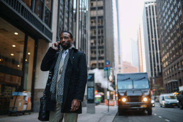 istock businessman on the phone in Lower Manhattan 1455356486