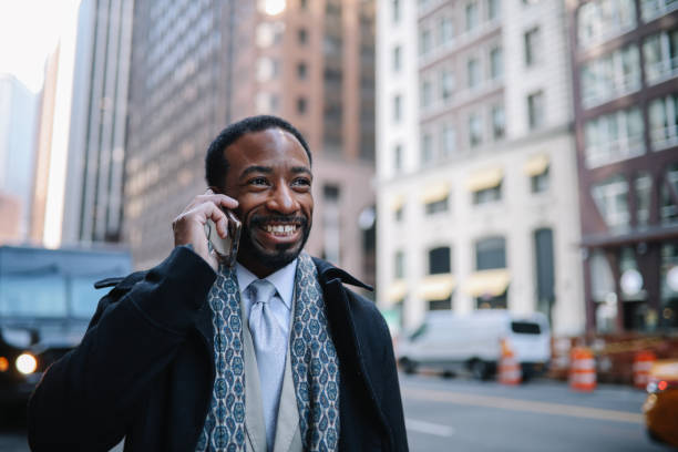 istock businessman on the phone in Lower Manhattan 1455356529