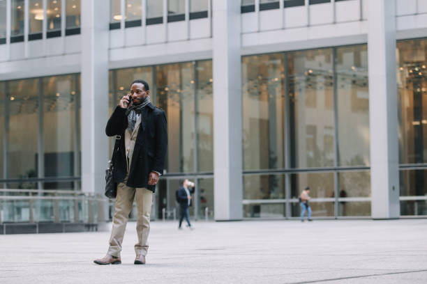 istock businessman on the phone in Lower Manhattan 1455356785