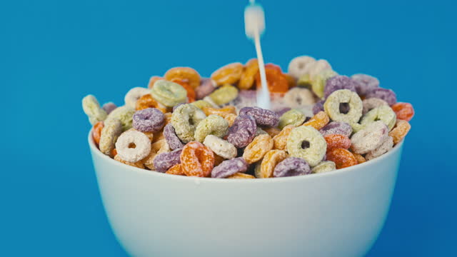 Milk Pour Into Dry Fruit Flavored Cereal at  Slow Motion