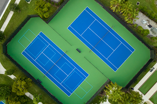 A closeup photo of the floor of a tennis court