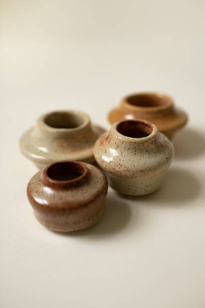 istock Simple Beginner Handmade Pottery Close Up of Little Clay Vases 1455364005