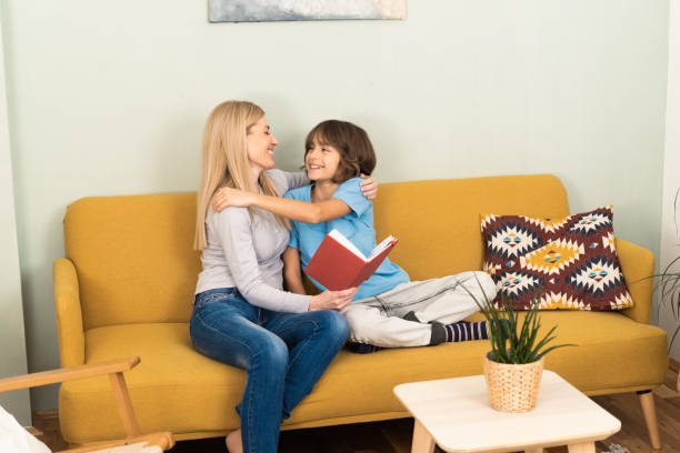 istock Young mom and small son relax at home 1455364390