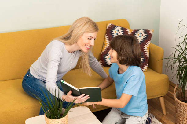 istock Young mom and small son relax at home 1455364449