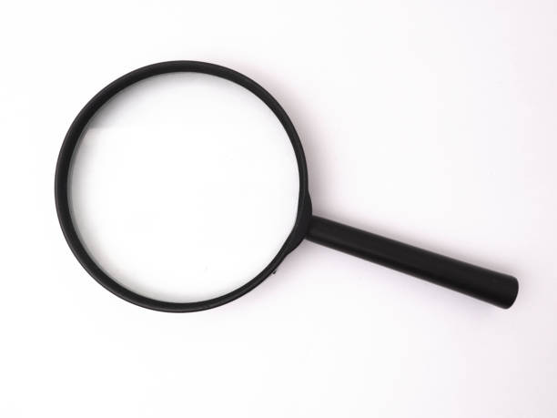 istock Black simple magnifying glass loupe isolated on white 1455365232