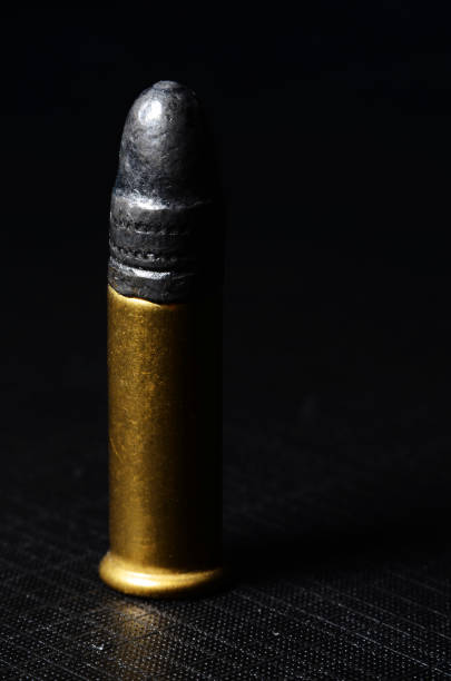 istock 9 mm Bullets pistol handgun isolated on black background 1455367609