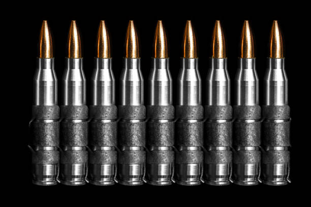 istock 7.62 mm Bullet chain ammunition M249 light machine gun  isolated on black background 1455367613