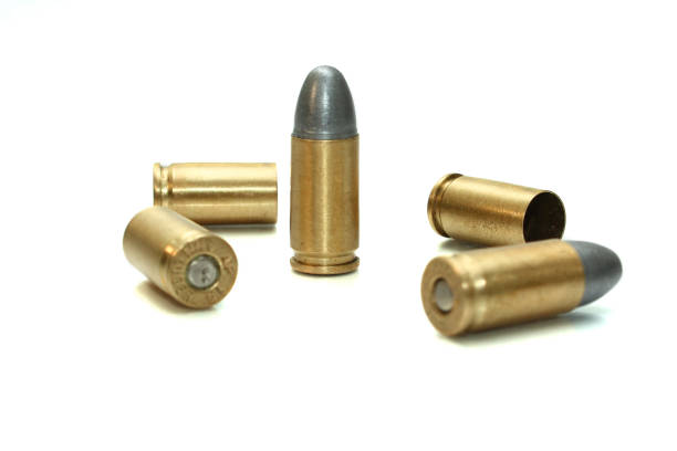 selective-focus bullet .45 and shell isolated on white background - full metal jacket imagens e fotografias de stock