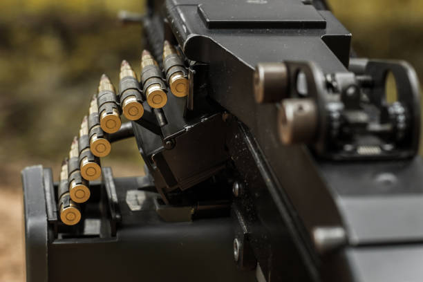 istock 7.62 mm cartridge belt on M249 light machine gun 1455368227