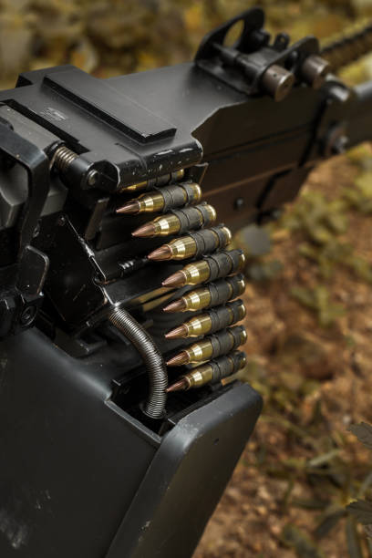istock 7.62 mm cartridge belt on M249 light machine gun 1455368230