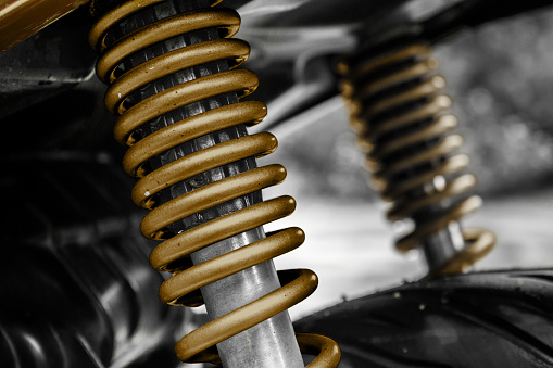 Close Up of Motorcycle Shock Absorber and Spring