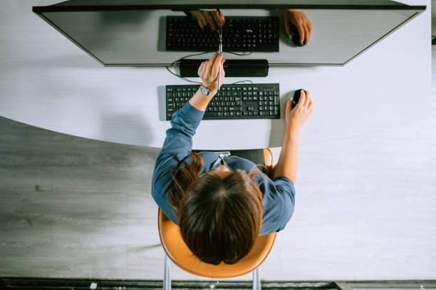 istock Business woman using digital tablet designing creative ideas and planning on her project at the contemporary office 1455373076
