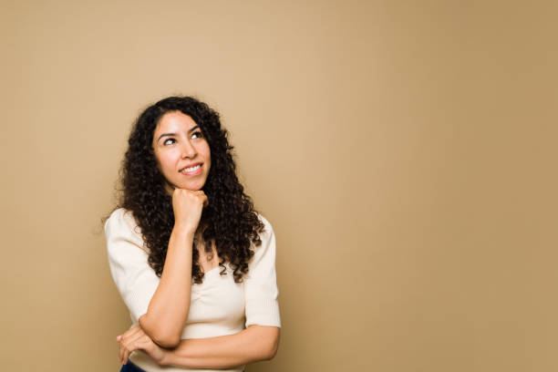 istock Pensive young woman creating a new idea 1455374712