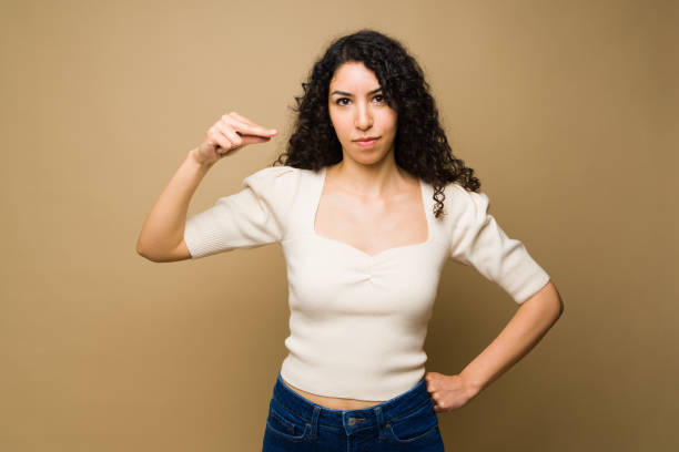 istock Stressed woman talking in sign language saying no 1455374771