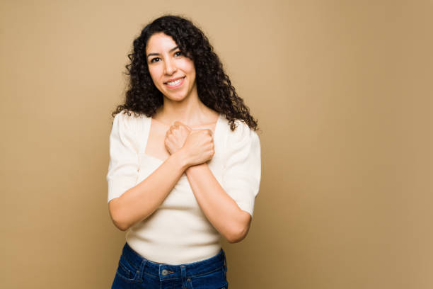 istock Happy woman saying love with sign language 1455374793