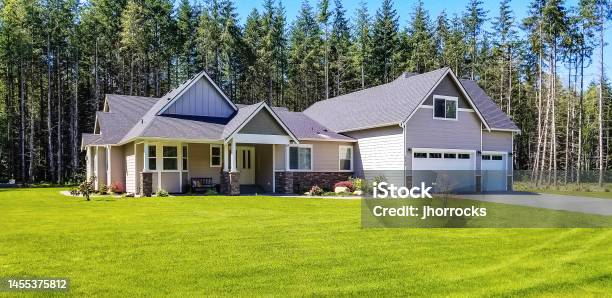Luxury Single Story Home Exterior Surrounded By Trees Stock Photo - Download Image Now