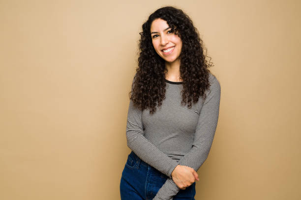 istock Beautiful cheerful young woman smiling 1455377332