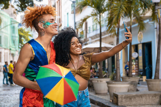 istock People capturing image at street carnival 1455377931