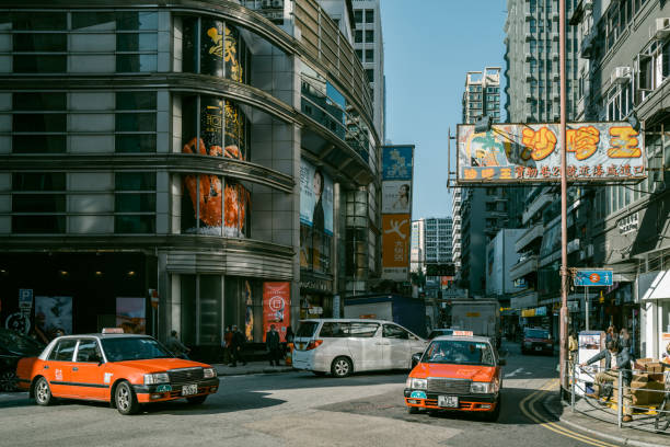 Hong Kong, December 20th 2022: locals and tourists enjoying sunshine, local landscape and daily life at Tsim Sha Tsui in HongKong, which is one of the busiest and most popular travel destinations in the world.