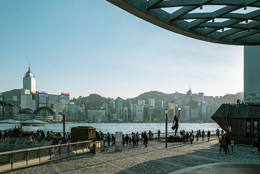 Hong Kong, December 20th 2022: locals and tourists enjoying sunshine, local landscape and daily life at Avenue of the stars in HongKong, which is one of the busiest and most popular travel destinations in the world.