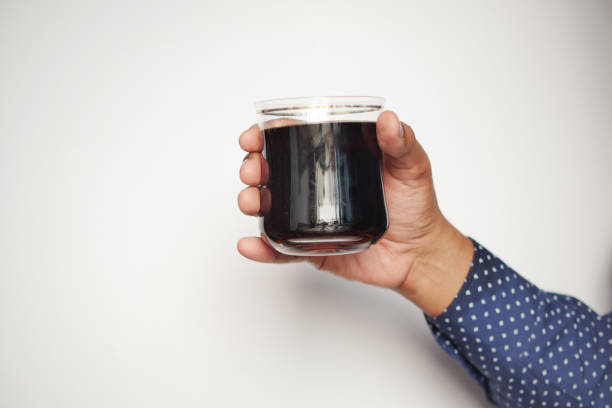 istock men holding a glass of soft drinks 1455382849