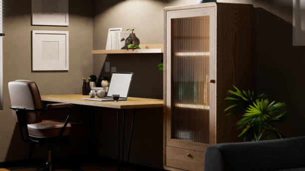 istock Stylish modern vintage home office workspace interior design with laptop on wood table 1455383400