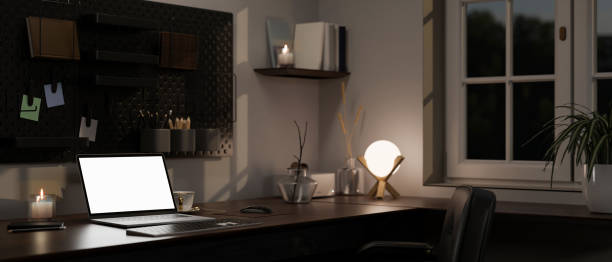 istock close-up image, Modern home workspace at night with laptop mockup, table lamp, accessories 1455383959
