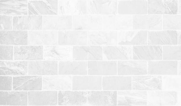 istock White grunge brick wall texture background for stone tile block painted in grey light color wallpaper modern interior and exterior and room backdrop design. Simple seamless pattern grid for backdrop. 1455385407