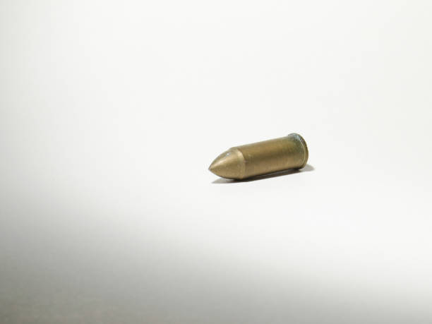 istock a Bullet isolated on white, the Bronze pistol bullet isolated on white 1455385437