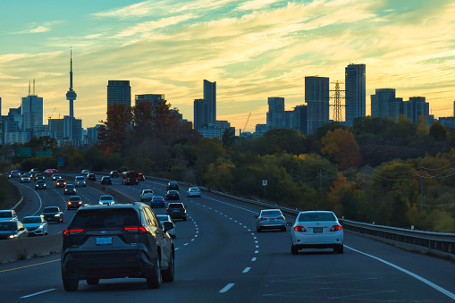 toronto, canada - 23 October 2022: cars driving in a traffic jam on a highway or parkway into the city